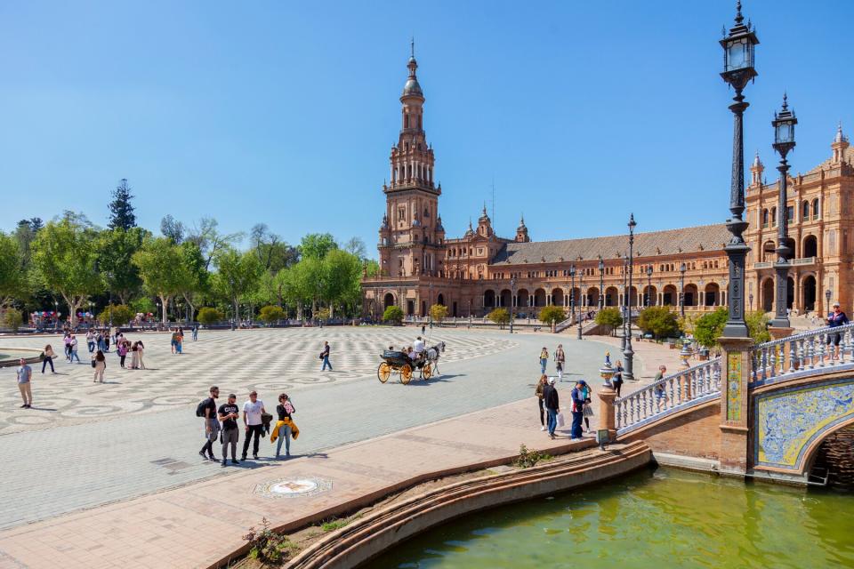 People relaxing in the Plaza de España, Sevilla.