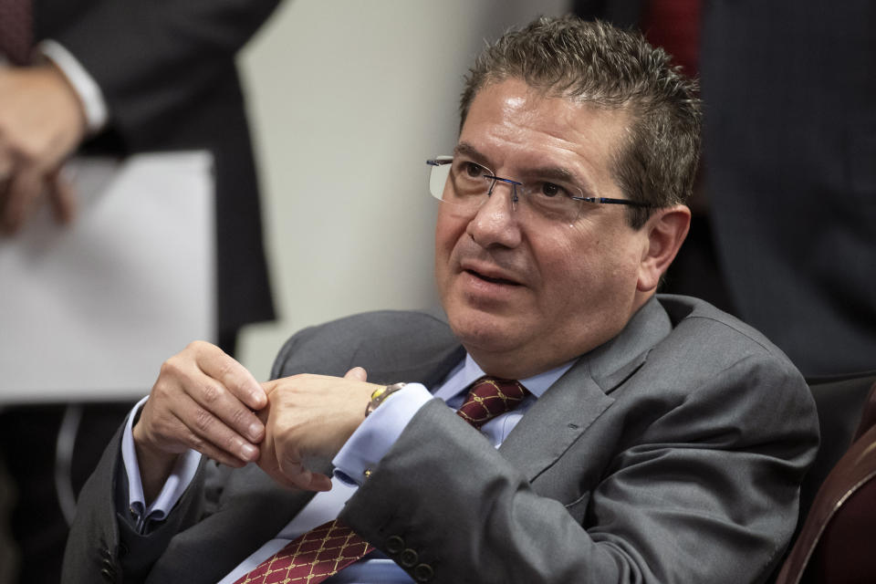 FILE - This Jan. 2, 2020, file photo shows Washington Redskins owner Dan Snyder listening to head coach Ron Rivera during a news conference at the team's NFL football training facility, in Ashburn, Va. Snyder has hired a D.C. law firm to review the Washington NFL team's culture, policies and allegations of workplace misconduct. Beth Wilkinson of Wilkinson Walsh LLP confirmed to The Associated Press that the firm had been retained to conduct an independent review. (AP Photo/Alex Brandon, File)