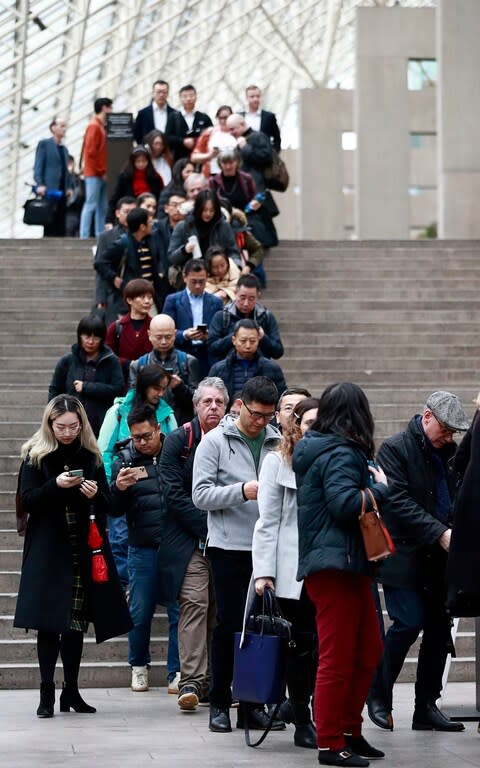 Members of the media and public line up outside a British Columbia Supreme courtroom on the first day of the extradition trial for Huawei Technologies Chief Financial Officer Meng Wanzhou on January 20, 2020 in Vancouver, Canada - Credit: Jeff Vinnick/Getty