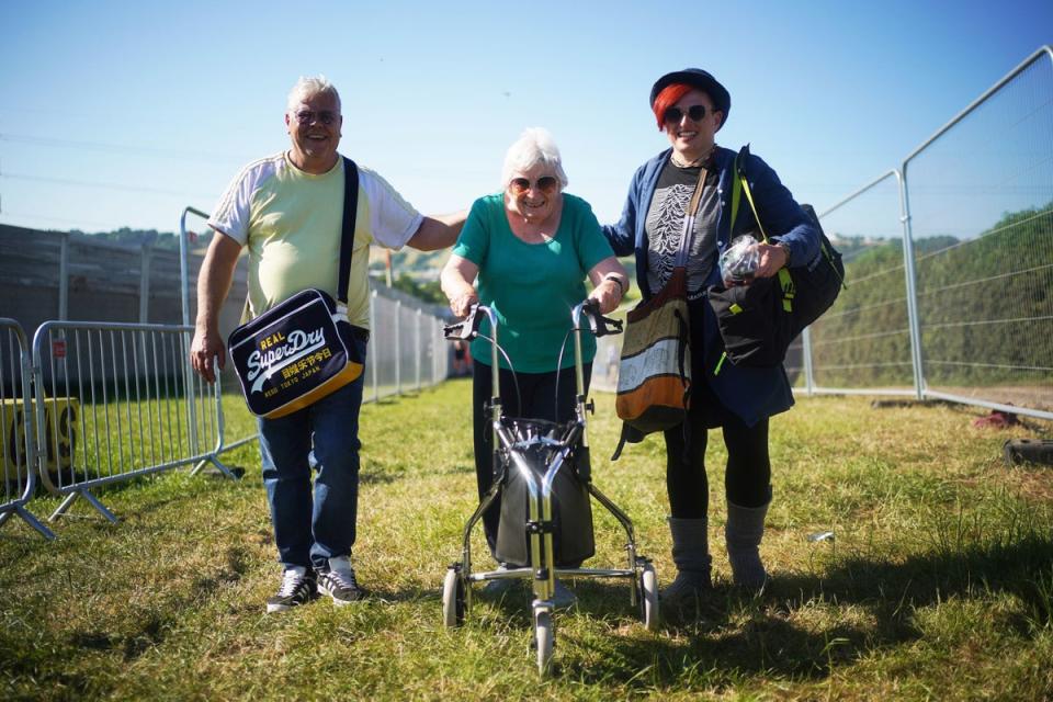 Left to right: Simon Lampard (52), Pat Brooks (82) and Linda Brooks-Lampard (51) arrive on the first day. Pat was given Glastonbury tickets for her 80th birthday (PA)