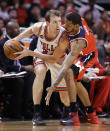 Chicago Bulls guard Mike Dunleavy, left, looks to a pass as Washington Wizards forward Trevor Ariza guards during the first half in Game 1 of an opening-round NBA basketball playoff series in Chicago, Sunday, April 20, 2014. (AP Photo/Nam Y. Huh)