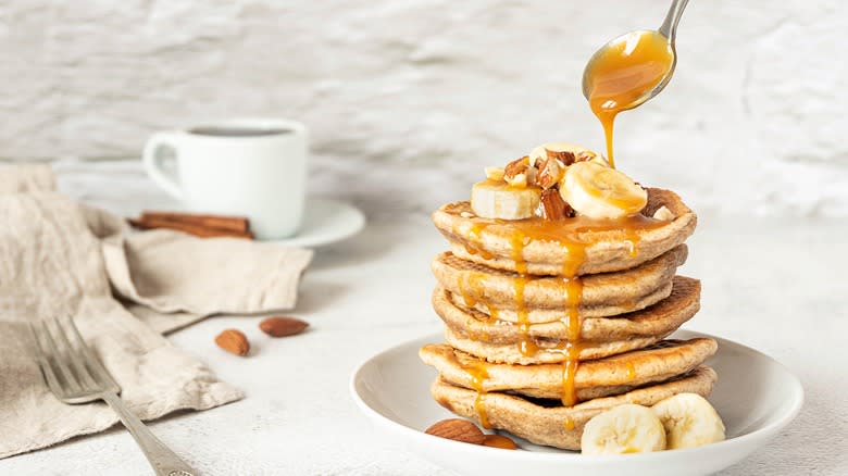 caramel sauce dripping on pancakes