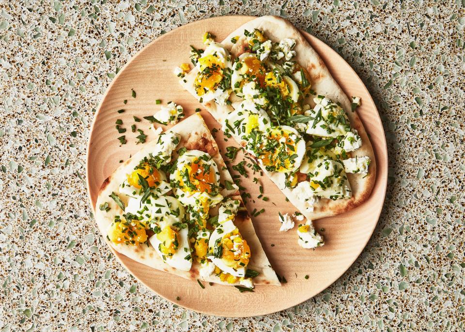Because older eggs are easier to peel, this is one of those recipes when grocery store eggs outperform the ones from the farmers’ market. <a rel="nofollow noopener" href="https://www.bonappetit.com/recipe/jammy-eggs-and-feta-flatbreads-with-herbs?mbid=synd_yahoo_rss" target="_blank" data-ylk="slk:See recipe.;elm:context_link;itc:0;sec:content-canvas" class="link ">See recipe.</a>
