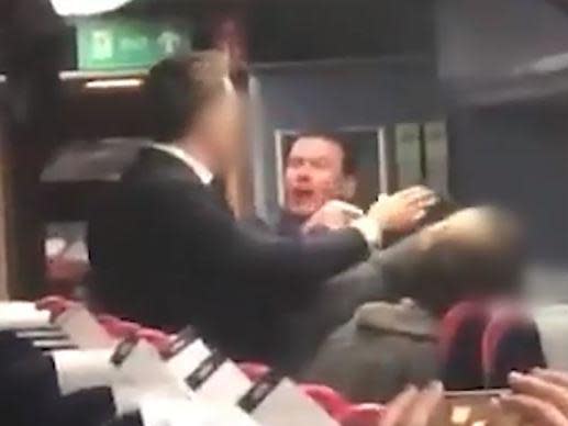 A man was filmed hurling racist abuse at an Asian couple aboard a train in Bristol