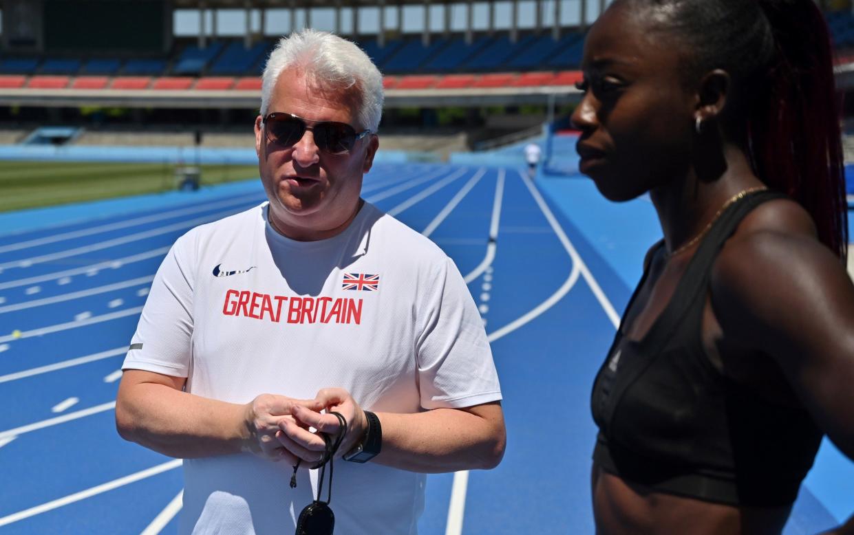 British coach Stephen Maguire (L) talks to Desiree Henry during a training session for the new mixed 400-metre relay team at Todoroki stadium in Kawasaki on May 8, 2019 - Stephen Maguire returns to UK Athletics as technical director - GETTY IMAGES