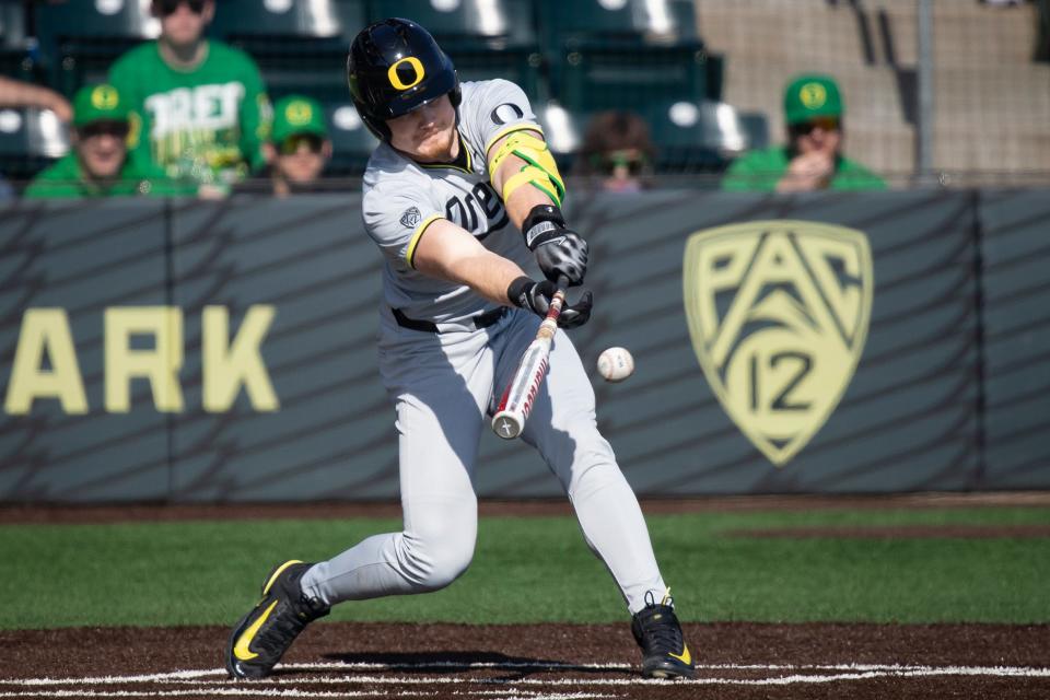 Oregon outfielder Bryce Boettcher hits a single as the Oregon Ducks host Lafayette Saturday, Feb. 24, 2024, at PK Park in Eugene, Ore.