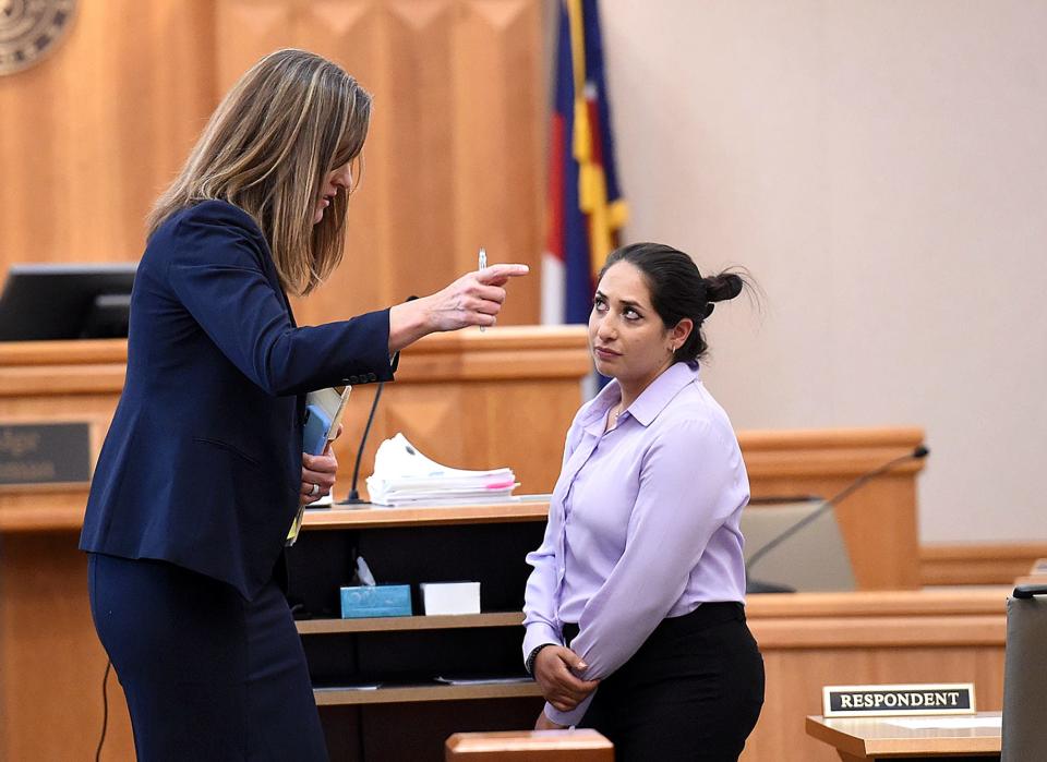 Daria Jalali, a former Loveland Police officer, talks with her attorney Anna Geigle, left, during court Wednesday, June 22, 2022, at the Larimer County Justice Center. Jalali pleaded guilty to failure to intervene in the use of excessive force, a class 1 misdemeanor.