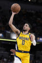 Indiana Pacers guard Tyrese Haliburton (0) shoots during the second half of Game 4 against the New York Knicks in an NBA basketball second-round playoff series, Sunday, May 12, 2024, in Indianapolis. (AP Photo/Michael Conroy)