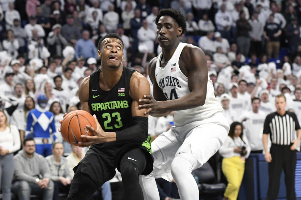 Michigan State's Xavier Tillman Sr. (23) tries to get past Penn State's Mike Watkins (24) during the first half of an NCAA college basketball game Tuesday, March 3, 2020, in State College, Pa. (AP Photo/John Beale)