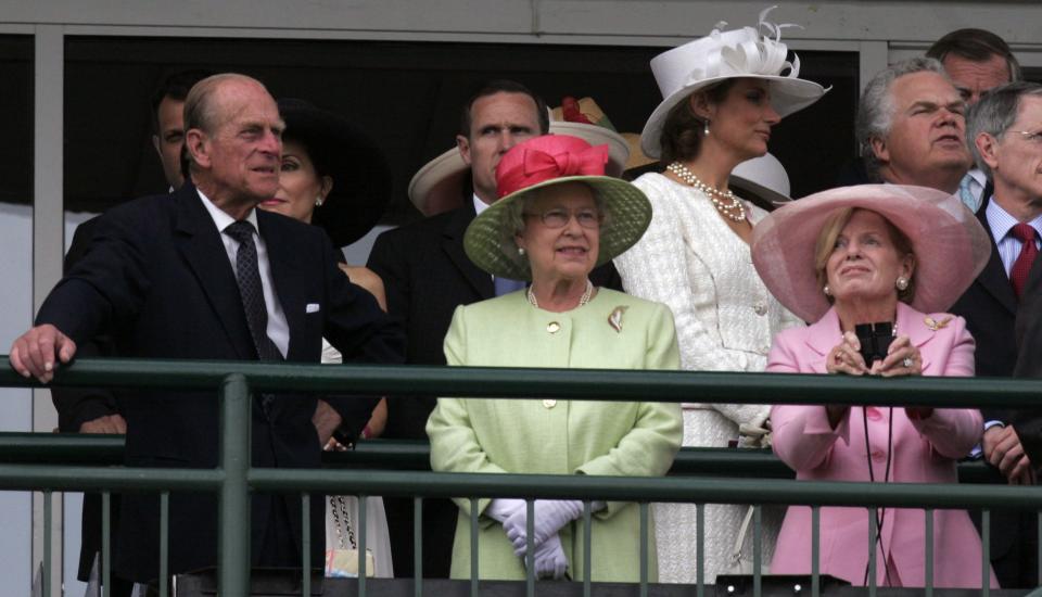 Queen Elizabeth, with Prince Phillip during the Distaff race, Saturday. _Photo by James Calvert, Special to the Courier-Journal