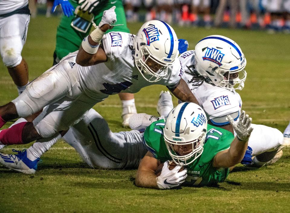 West Florida's David Durden (17) tries for more yardage Saturday, October 16, 2021 during the West Florida West Georgia game at Blue Wahoos Stadium.