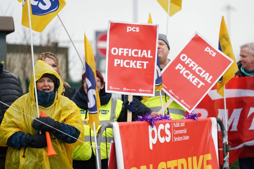 Members of the Public and Commercial Services (PCS) union on the picket line outside Birmingham Airport. (PA)