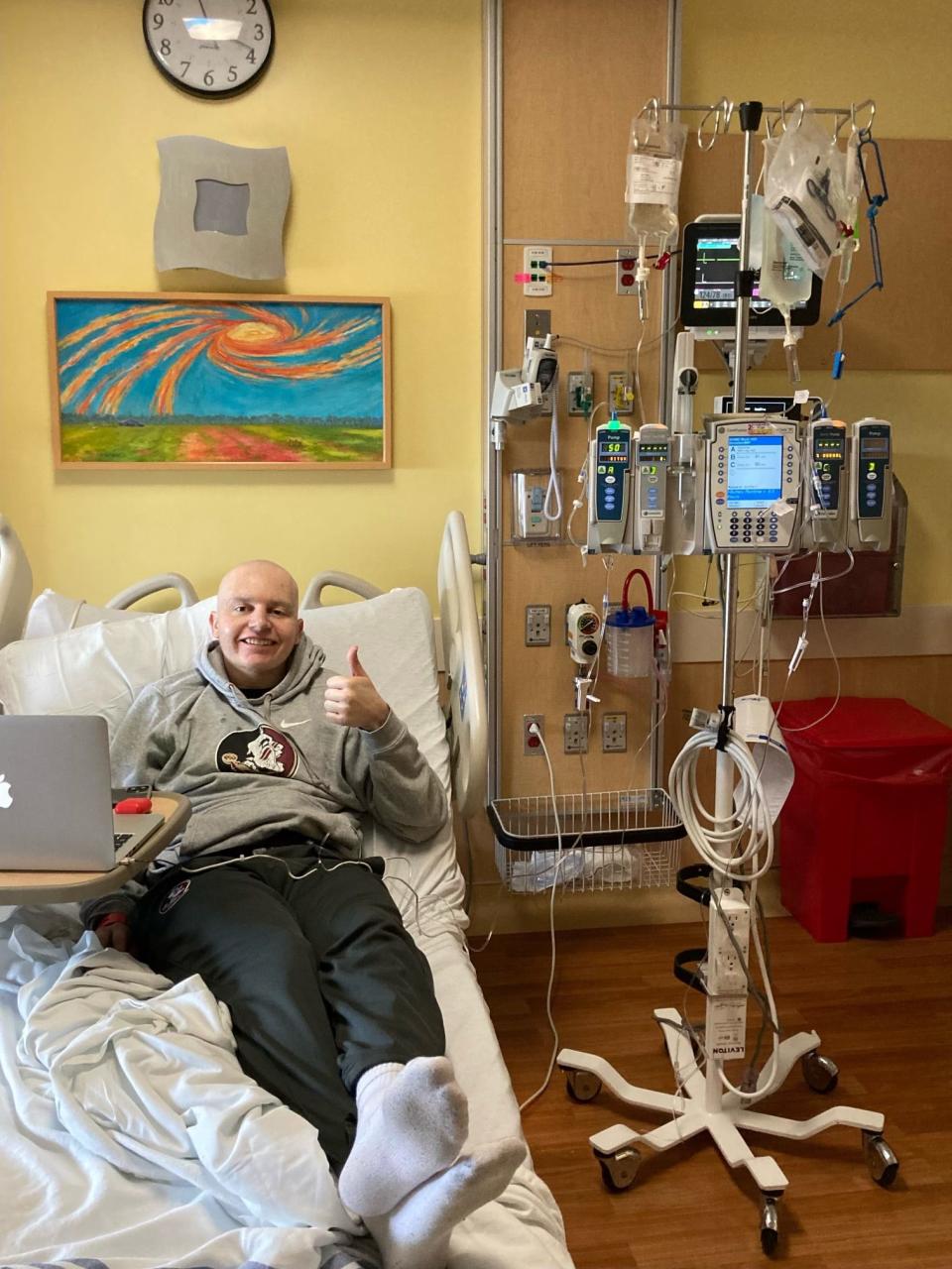 Former Florida State graduate assistant Jared Lynn, who is now in remission after being diagnosed with stage four non-Hodgkin lymphoma cancer in February, poses for a picture in a hospital bed.