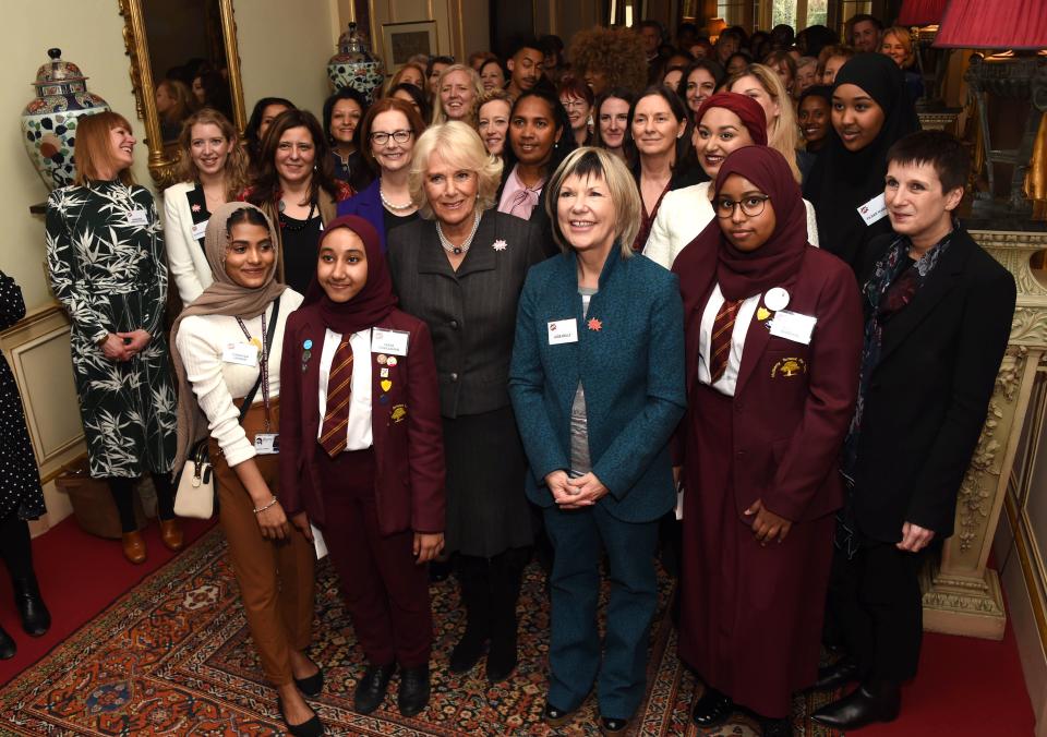 Britain's Camilla, Duchess of Cornwall (C), President of WOW - Women of the World, poses for a photograph with guests as she hosts a reception for the organisation at Clarence House on March 7, 2019 in London. (Photo by Stuart C. Wilson / POOL / AFP)        (Photo credit should read STUART C. WILSON/AFP via Getty Images)