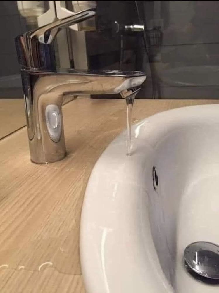 A faucet that's not long enough to clear the side of the basin