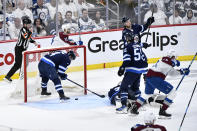 Colorado Avalanche players celebrates the goal by Zach Parise against the Winnipeg Jets during the second period in Game 2 of an NHL hockey Stanley Cup first-round playoff series Tuesday, April 23, 2024, in Winnipeg, Manitoba. (Fred Greenslade/The Canadian Press via AP)