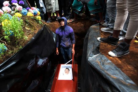 Relatives and friends take part in the funeral service of Jose Esteban Sevilla Medina, who died during clashes with pro-government supporters in Monimbo, Nicaragua. REUTERS/Oswaldo Rivas