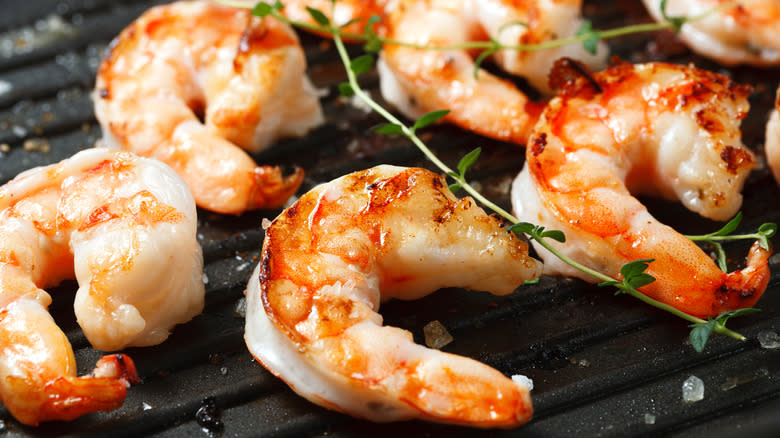 shrimp cooking on a grill