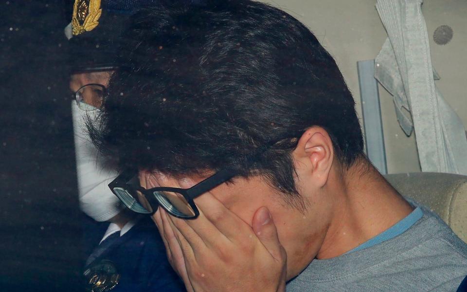 Takahiro Shiraishi is pictured leaving a police station in the Hachioji suburb of Tokyo in November, 2017 -  Kyodo News