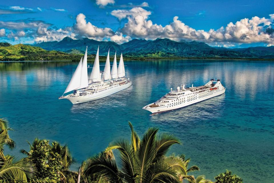 A Windstar cruise ship and sail boat at sea