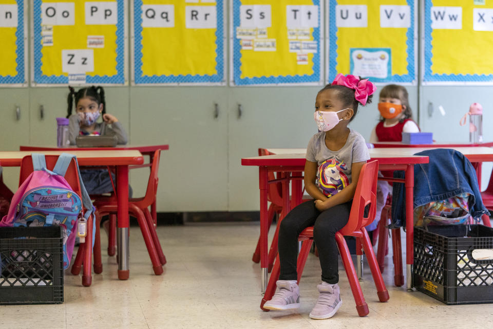 Students sit in a distanced pattern from their classmates during the coronavirus outbreak in a Kindergarten class at School 16, Tuesday, Oct. 20, 2020, in Yonkers, N.Y. (AP Photo/Mary Altaffer)