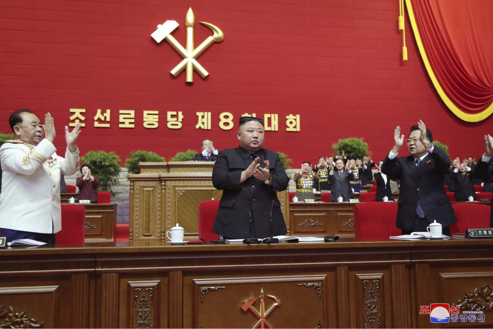 In this photo provided by the North Korean government, North Korean leader Kim Jong Un, center, claps his hands at the ruling party congress in Pyongyang, North Korean, Sunday, Jan. 10, 2021. Kim was given a new title, “general secretary” of the ruling Workers’ Party, formerly held by his late father and grandfather, state media reported Monday, Jan. 11, in what appears to a symbolic move aimed at bolstering his authority amid growing economic challenges. Independent journalists were not given access to cover the event depicted in this image distributed by the North Korean government. The content of this image is as provided and cannot be independently verified. Korean language watermark on image as provided by source reads: "KCNA" which is the abbreviation for Korean Central News Agency. (Korean Central News Agency/Korea News Service via AP)