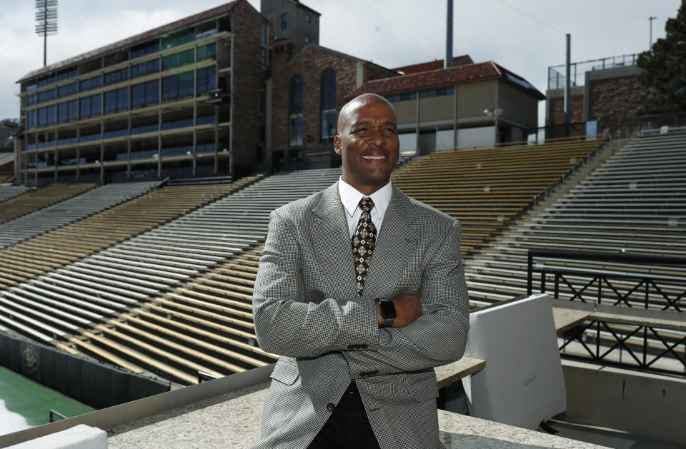 Karl Dorrell poses for a photograph overlooking Folsom Field after a news conference to announce that he is the new NCAA college head football coach at Colorado during a news conference Monday, Feb. 24, 2020, in Boulder, Colo. (AP Photo/David Zalubowski)