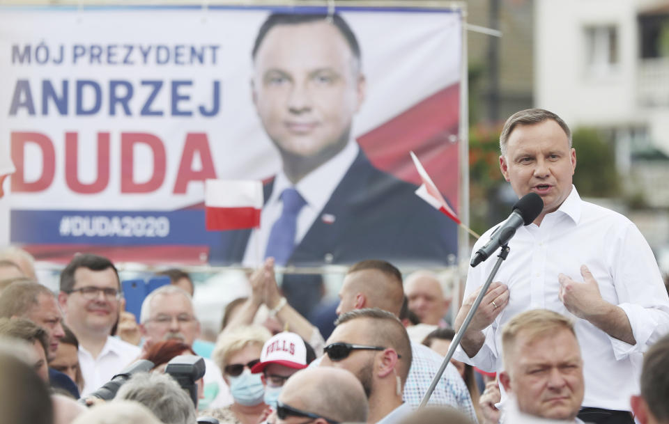 Polish President Andrzej Duda waves to supporters as he campaigns for a second term in Serock, Poland, on Wednesday, June 17, 2020.Duda is the frontrunner ahead of the election on Sunday, June 28, but is not expected to reach the 50 percent threshold needed to win outright. That will require a runoff two weeks later in which he is expected to face off against Warsaw Mayor Rafal Trzaskowski in a very close race.(AP Photo/Czarek Sokolowski)