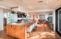 <p>The kitchen features a chef's pantry and breakfast bar.</p>