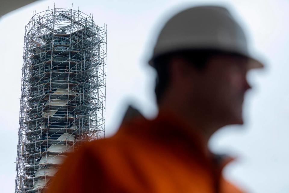 The Cape Hatteras Lighthouse is surrounded by scaffolding as it undergoes restoration on Monday, July 1, 2024. The project is expected to cost $19.2 million and will include replacing 40,000 of its estimated 1,250,000 bricks, replacing rusted or broken metal components and the installation of a near-exact replica of the first-order Fresnel lens.