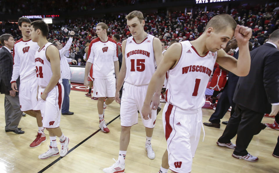 Wisconsin's Duje Dukan, left, Bronson Koenig (24) Evan Anderson, Sam Dekker (15) and Ben Brust (1) walk off the court after losing 59-58 to Ohio State in an NCAA college basketball game Saturday, Feb. 1, 2014, in Madison, Wis. (AP Photo/Andy Manis)