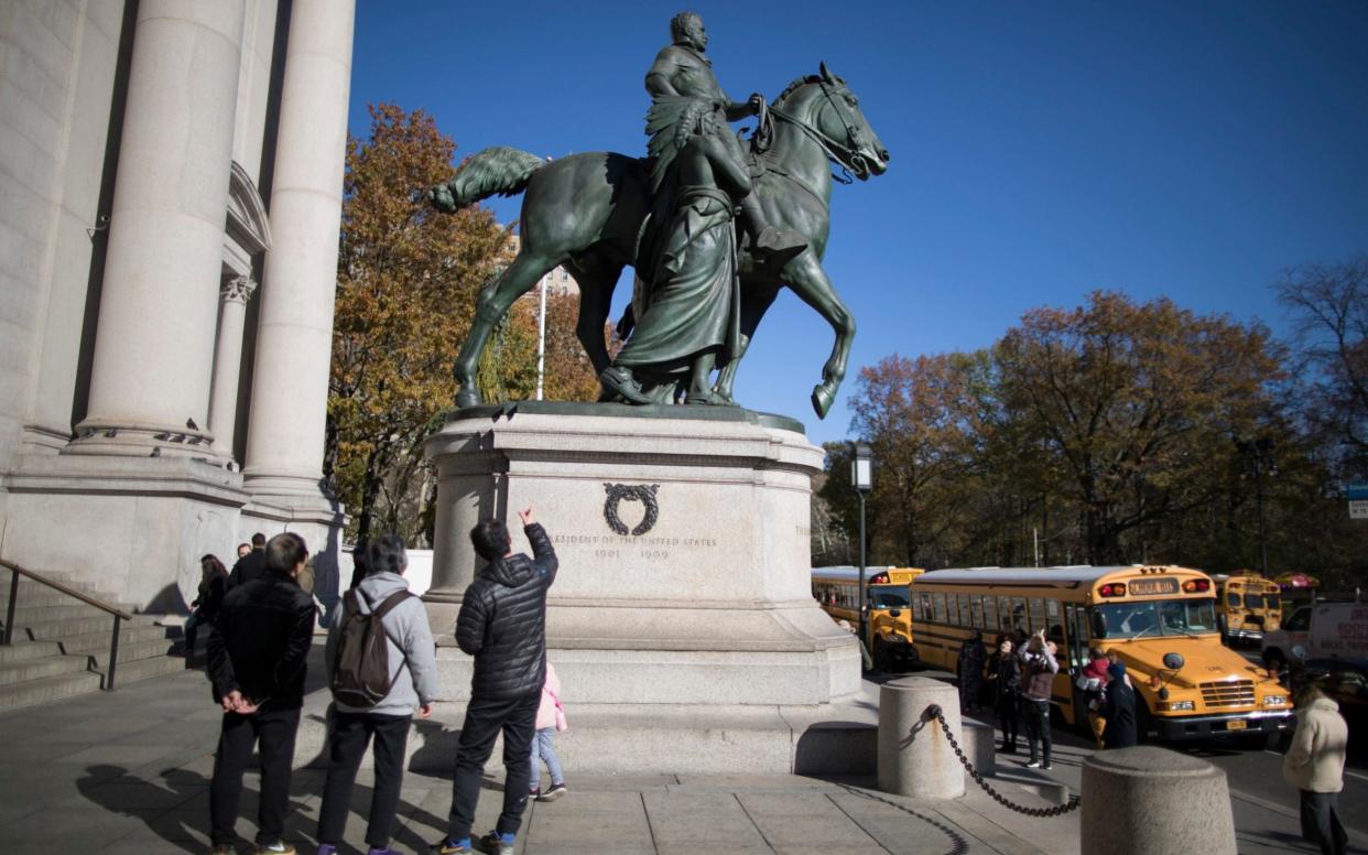Statue of Theodore Roosevelt will be coming down after the museum's proposal to remove it was approved by the city  - AP