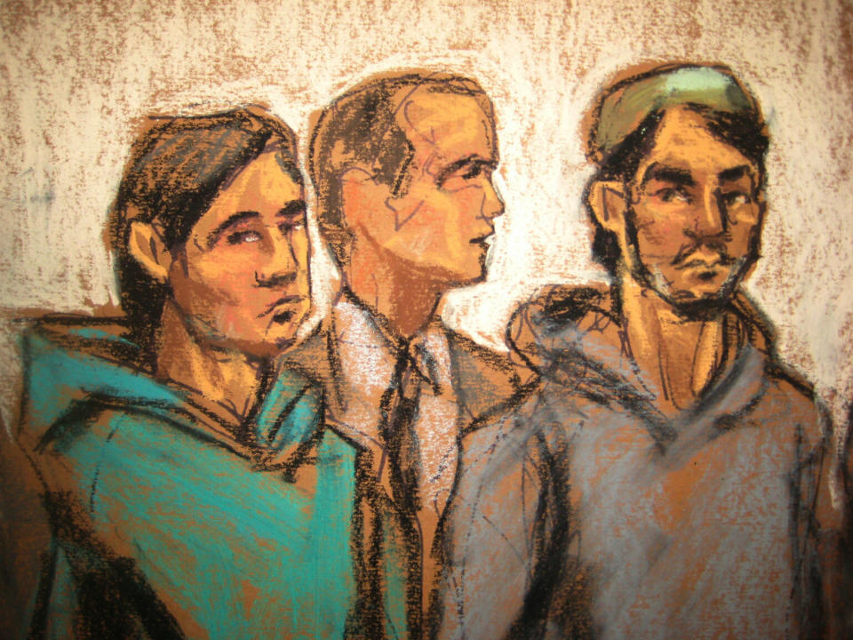 In this courtroom drawing, defendant Akhror Saidakmetov, left, an interpreter, center, and defendant Abdurasul Juraboev appear at federal court in New York on terrorism charges, Feb. 25, 2015. Saidakmetov and Juraboev are two of the three men arrested on charges of plotting to travel to Syria to join the Islamic State group and wage war against the U.S. (Photo of sketch: Jane Rosenberg/AP)