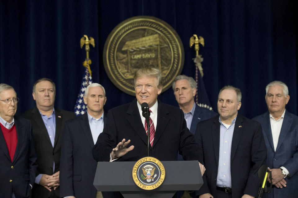 FILE - President Donald Trump, center, accompanied by from left, Senate Majority Leader Mitch McConnell of Ky., Vice President Mike Pence, House Majority Leader Kevin McCarthy of Calif., House Majority Whip Steve Scalise, R-La., Secretary of State Rex Tillerson, speaks after participating in a Congressional Republican Leadership Retreat at Camp David, Md., Jan. 6, 2018. (AP Photo/Andrew Harnik, File)