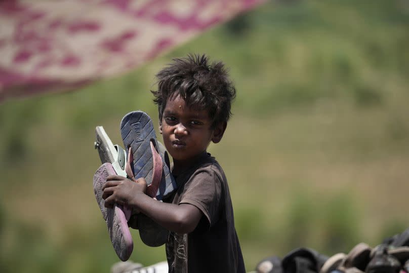 Waste picker Arjun, 6, works at a Jammu garbage dump site 