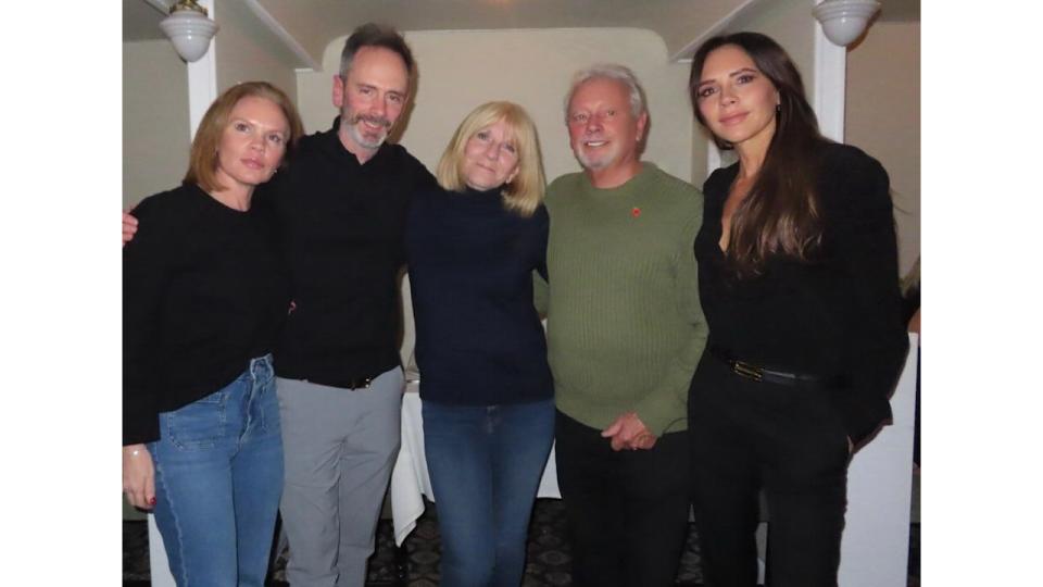 family posing for photo indoors 