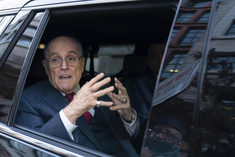 FILE - Rudy Giuliani talks to reporters as he leaves after his defamation trial in Washington, Dec. 15, 2023. Giuliani has been disbarred in New York. The former New York City mayor, federal prosecutor and legal adviser to Donald Trump received the decision Tuesday, July 2, 2024 from an appeals court in Manhattan. (AP Photo/Jose Luis Magana, File)