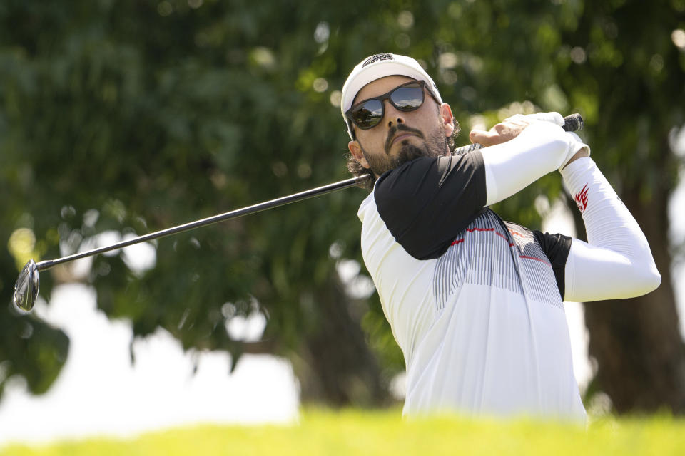 Abraham Ancer of Fireballs GC hits his shot from the thirteenth tee during the first round of LIV Golf Singapore at Sentosa Golf Club in Sentosa, Singapore, Friday, May 3, 2024. (Charles Laberge/LIV Golf via AP)