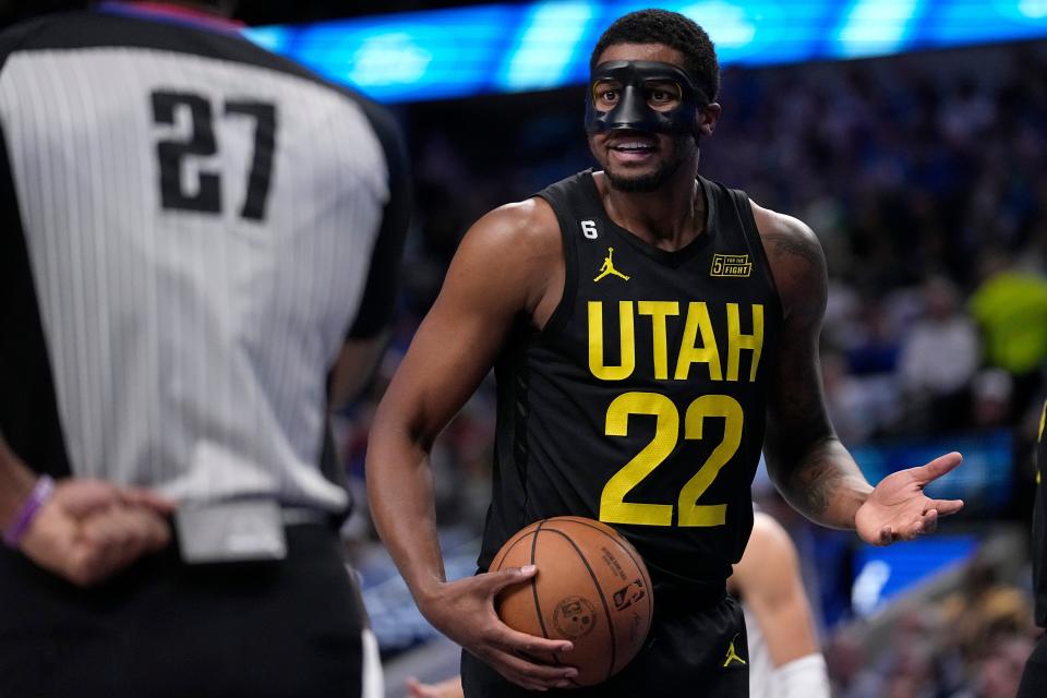 Utah Jazz forward Rudy Gay (22) look to referee Mitchell Ervin (27) after a call against his team in the first half of an NBA basketball game against the Dallas Mavericks, Tuesday, March 7, 2023, in Dallas. (AP Photo/Tony Gutierrez)