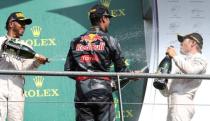 Belgium Formula One - F1 - Belgian Grand Prix 2016 - Francorchamps, Belgium - 28/8/16 - Mercedes' Nico Rosberg of Germany celebrates on the podium with teammate Lewis Hamilton of Britain and Red Bull's Daniel Ricciardo of Australia after the Belgian F1 Grand Prix. REUTERS/Yves Herman