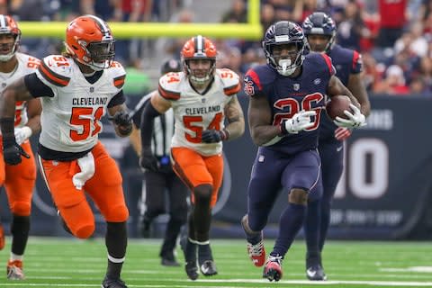 Houston Texans running back Lamar Miller (26) runs for yards while being chased by Cleveland Browns outside linebacker Jamie Collins (51) during the fourth quarter at NRG Stadium - Credit: John Glaser/USA TODAY