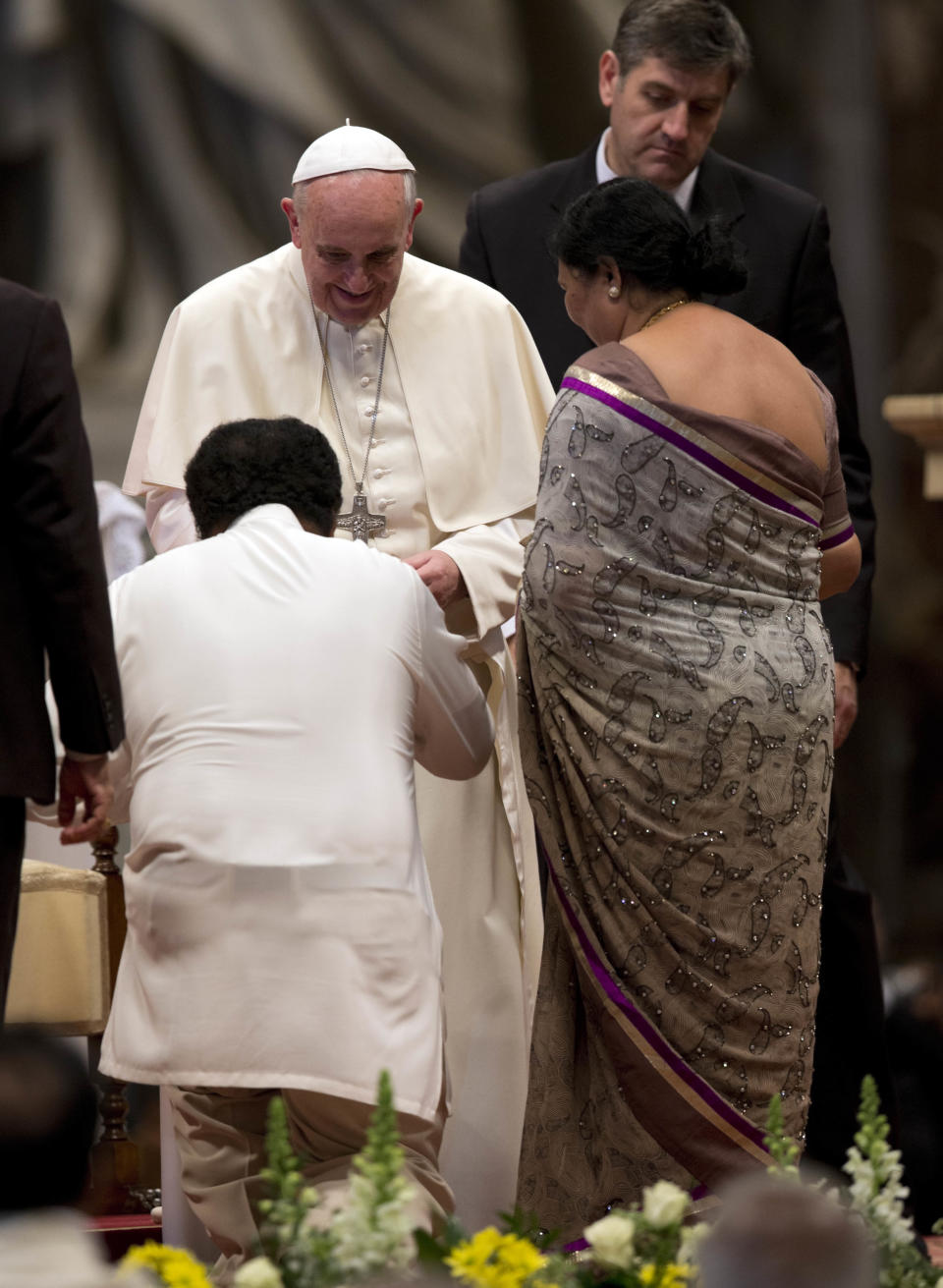 Members of the Sri Lankan community greet Pope Francis at the end of a mass in St. Peter's Basilica at the Vatican, Saturday, Feb. 8, 2014. (AP Photo/Alessandra Tarantino)