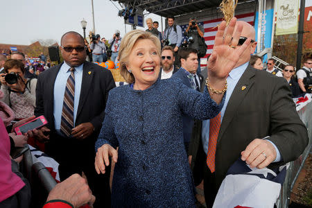 U.S. Democratic presidential nominee Hillary Clinton greets audience members at a campaign rally in Cedar Rapids, Iowa, U.S. October 28, 2016. REUTERS/Brian Snyder