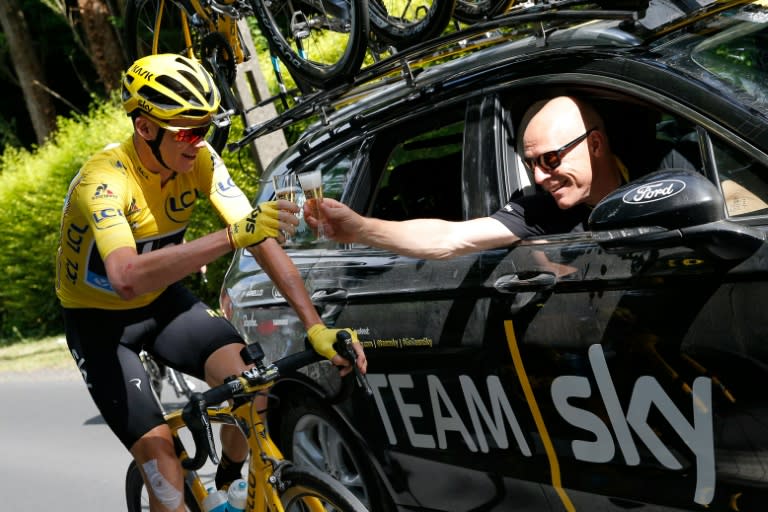 Team Sky Team Principal Dave Brailsford (right) and Tour de France leader Chris Froome drink a glass of champagne in Chantilly at the start of the last stage of the 2016 tour on July 24, 2016