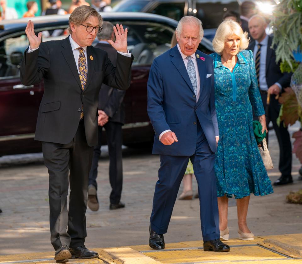 queen camilla, bridgerton cast, chelsea flower show, peacock  Fiona Clare dress, eliot suede wedge heels, Kiki McDonough and Van Cleef & Arpels jewelry, royal horticultural society rhs