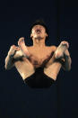 GUANGZHOU, CHINA - NOVEMBER 26: Sho Sakai of Japan competes in the Men's Preliminary 10m Platform at Aoti Aquatics Centre during day fourteen of the 16th Asian Games Guangzhou 2010 on November 26, 2010 in Guangdong, China. (Photo by Adam Pretty/Getty Images)