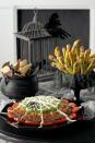 <p>Give basic Mexican dip an upgrade with this terrifyingly tasty recipe designed to look like a spiderweb. </p><p><strong><a rel="nofollow noopener" href="https://www.womansday.com/food-recipes/food-drinks/recipes/a9948/spiderweb-nacho-spread-recipe-121386/" target="_blank" data-ylk="slk:Get the recipe;elm:context_link;itc:0;sec:content-canvas" class="link ">Get the recipe</a>.</strong></p>