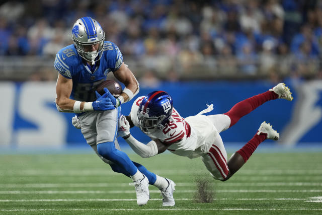 Detroit Lions quarterback Adrian Martinez (18) keeps the ball during the  second half of an NFL