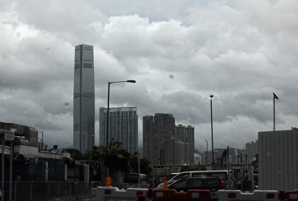 International Commerce Centre (ICC), the tallest building, is seen as the Tropical Storm Wipha approaches Hong Kong Wednesday, July. 31, 2019. The Asian financial center of Hong Kong is shutting down as Wipha approaches, bringing heavy rain and gusts of up to 95 kph (60 mph) in some areas. (AP Photo/Vincent Yu)