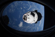 FILE - In this Saturday, April 24, 2021, file photo made available by NASA, the SpaceX Crew Dragon capsule approaches the International Space Station for docking. SpaceX is scrambling to resolve toilet spills in its capsules before it launches another crew for NASA. Liftoff is currently set for early Sunday, Oct. 31, from Florida's Kennedy Space Center. (NASA via AP, File)